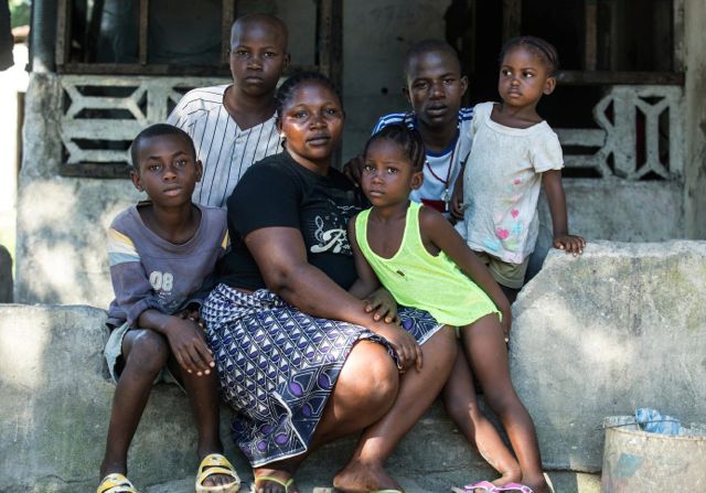 Helen Morris hugs children she&#039;s been caring for goodbye before they are driven to foster homes or the homes of extended family members, at an interim care centre for children exposed to EVD