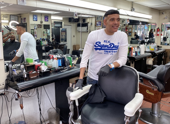 Edwin Martinez, a barber in Brownsville neighborhood of Brooklyn, New York, has helped recruit other community members with strong ties to youth to get involved in the UNICEF USA-supported Arthur Ashe program.