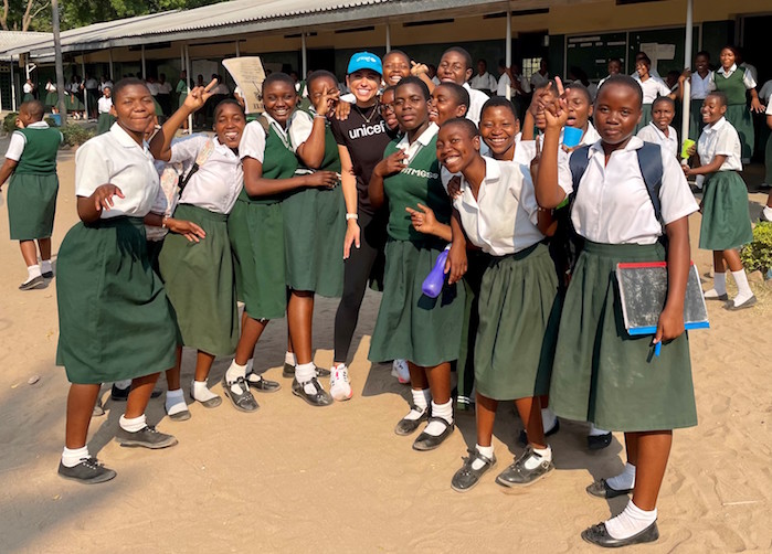 UNICEF USA's Nina Marie Costa, center, with K.I.N.D. Fund scholarship students who attend St. Monica Girls' Secondary School in the Mangochi Region of southern Malawi. 