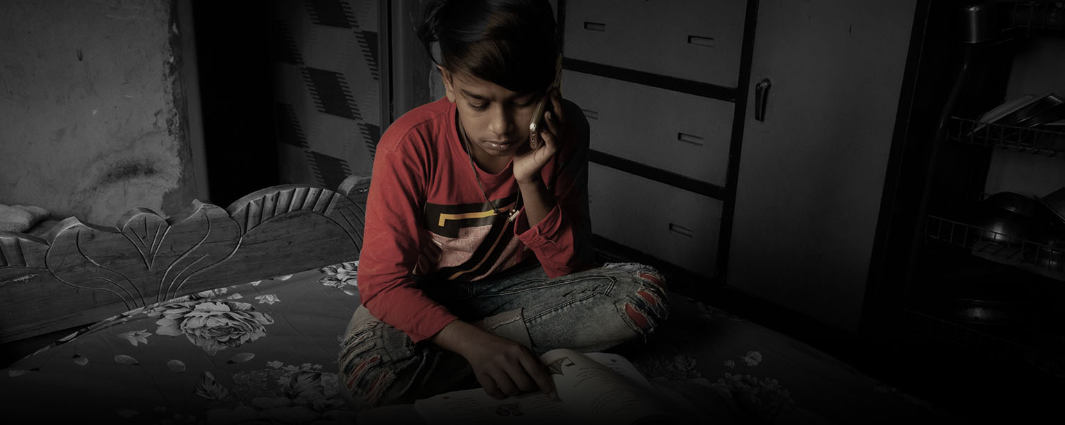 a student studies while on the phone