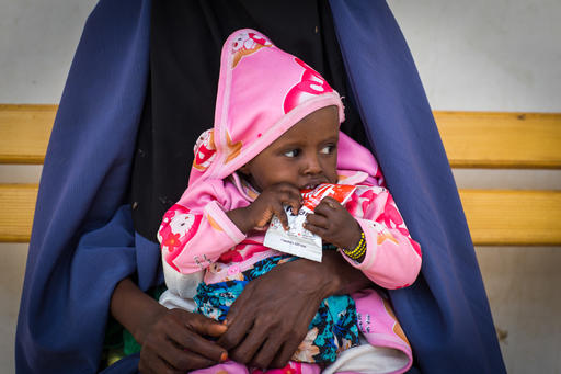 A child in Ethiopia eats UNICEF-supplied Ready to Use Therapeutic Food. This nutritious packet of food, just one of the Father’s Day Gift Basket items, is full of all the proteins and vitamins children need to stave off malnutrition.