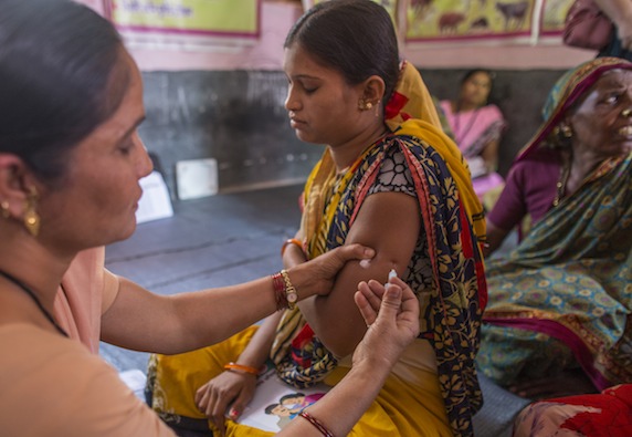 woman in India is immunized for tetanus