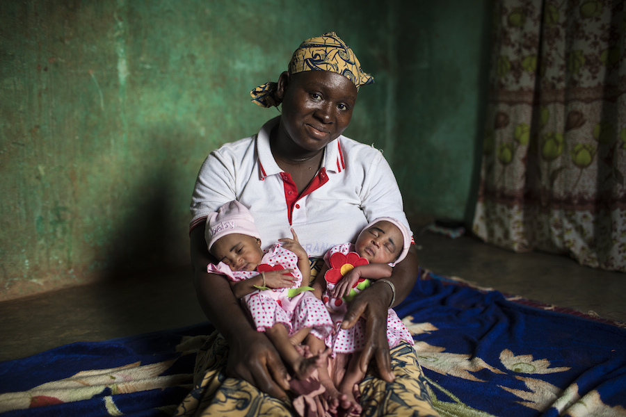 Fatoumata of Mali, mother of five pictured with her twin daughters, makes sure all her children get vaccinated to keep them healthy.