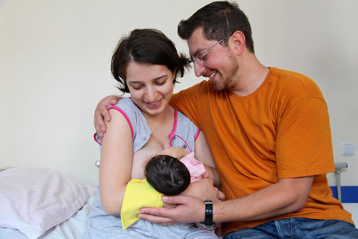 Parents of a newborn photographed at the maternity ward of a hospital in Yerevan, Armenia.