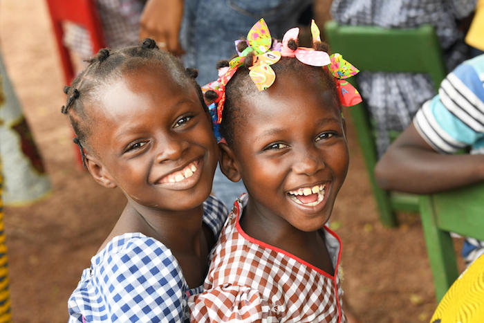 Happy students in a UNICEF-supported school in Feremandougou, a village in the North East of Côte d'Ivoire in 2018.
