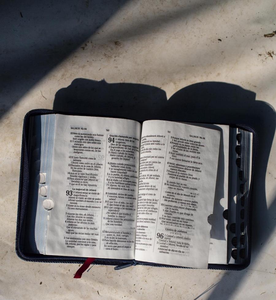 In Tecun Uman, Guatemala, Mariza, 38, displays the bible she carried with her on her journey from Honduras. 