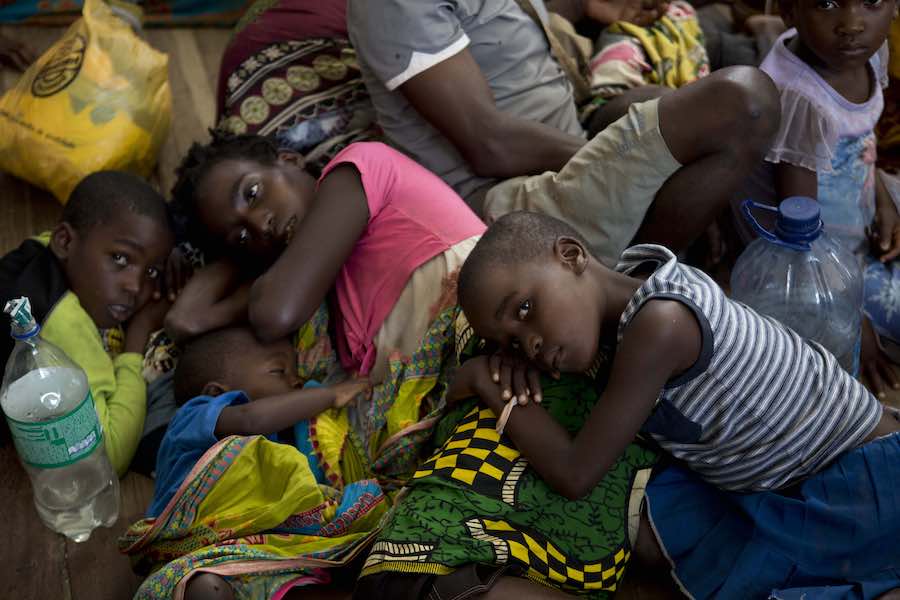 Displaced people rest at the Samora Machel school, where they were brought after their homes were destroyed and flooded, in Buzi, Mozambique, on Saturday 23 March 2019.