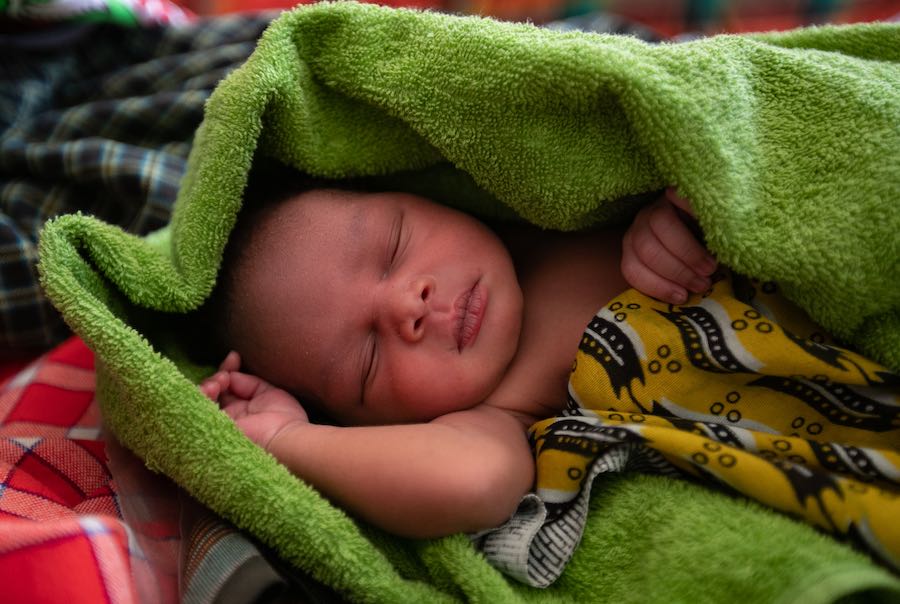 Newborn child at Nabilatuk H/C IV, Kaabong District is wrapped in a clean a warm towel provided to mothers upon delivery, through the newborn kits.  UNICEF with funding from KOICA provides mothers with newborn kits upon delivery at the health facility. Th