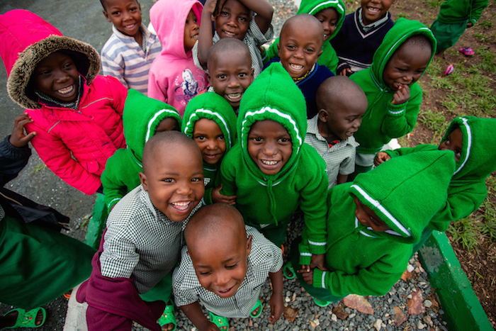 While their mothers work in fields and factories nearby, these children learn and play at the UNICEF-supported Early Child Development center at Rutsiro Tea Plantation in Rwanda.