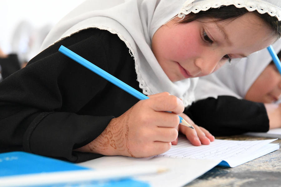 Children at the Bibi Amina Girls High School in Panjshir, a province in the North of Afghanistan, are excited with their new UNICEF school kits.