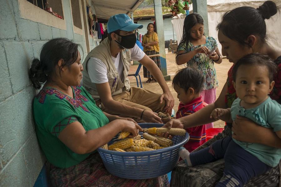 Manuel Moreno, UNICEF Communication Specialist, delivers a hygiene kit to a family affected by hurricane damage in Guatemala.