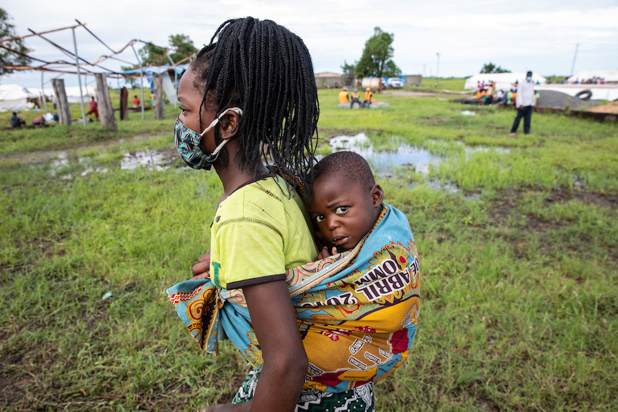 A mother and child affected by Cyclone Eloise arrive at a relocation center supported by UNICEF some 50 miles outside of the port city of Beira, Sofala province, Mozambique.