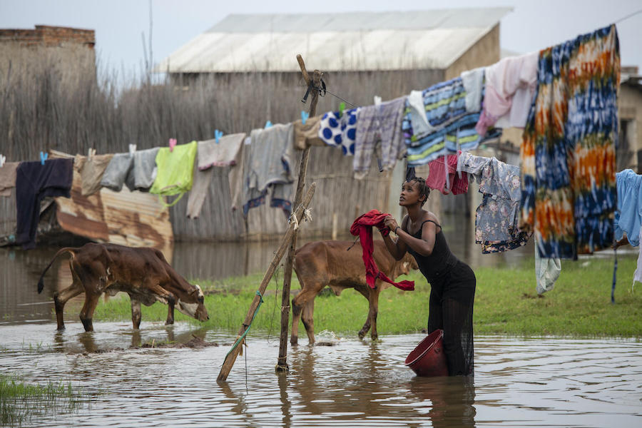A woman hangs laundry in the displacement camp in Gatumba, near Bujumbura in Burundi, an area devastated by floods and other climate-related shocks.