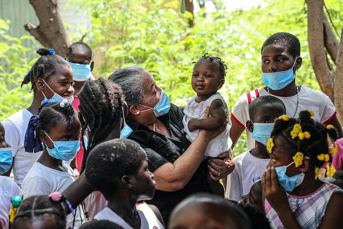 Jean Gough, UNICEF Regional Director for Latin America and the Caribbean, in Bass Delmas, Port-au-Pince, Haiti, visited with children receiving psychosocial support services from UNICEF during a 6-day visit to the country in May 2021.