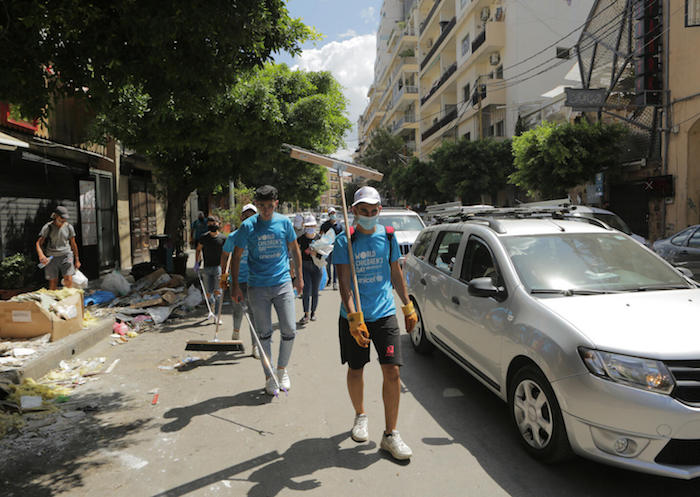 UNICEF youth network volunteers gather on the devastated Mar Mikhael to help some of the city’s citizens in the clean-up of Beirut after the port explosion.