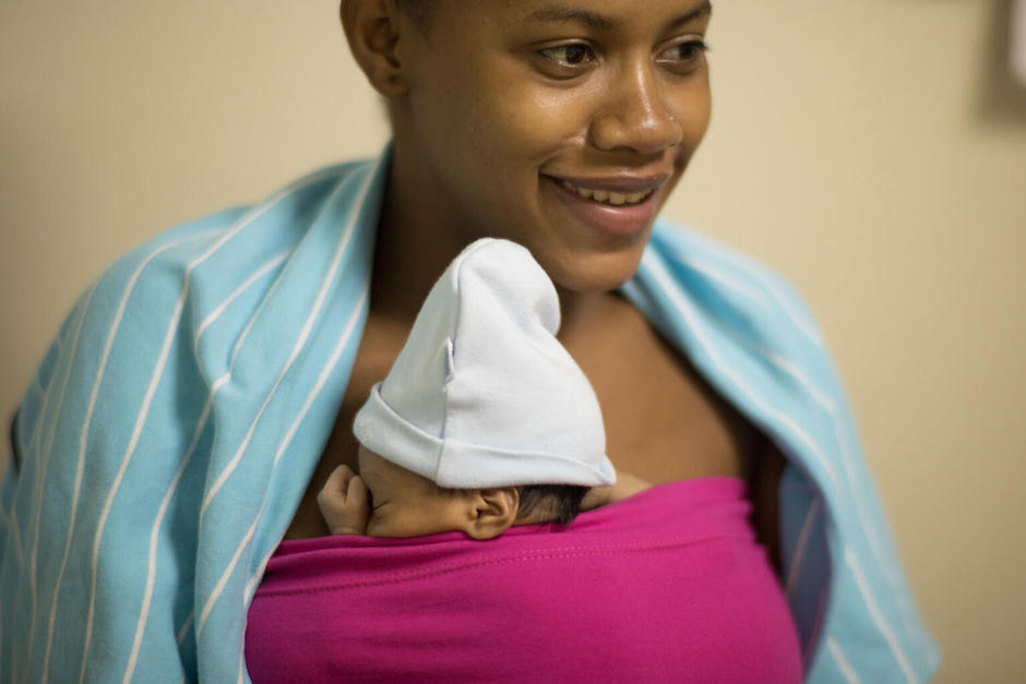 A mother in Santo Domingo, Dominican Republic, practices kangaroo care, promoted by UNICEF maternal and neonatal health programs.