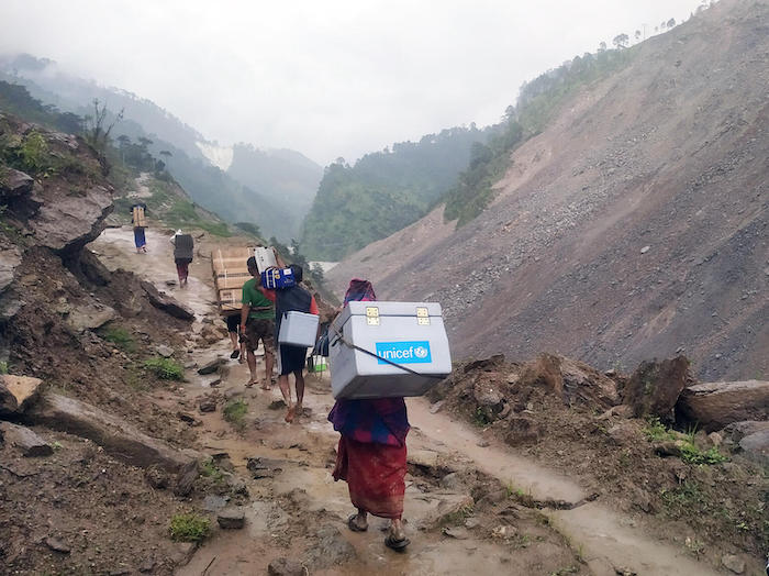UNICEF team travels on foot to deliver vaccines and other health supplies to the Bajura district in far-western Nepal. 