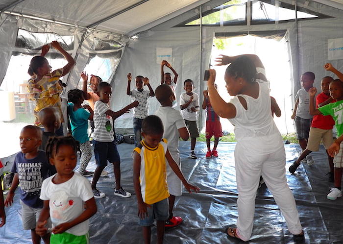 In the days after Haiti's devastating August 14, 2021 earthquake, children participate in psychosocial support activities at a UNICEF Child-Friendly Space set up in Les Cayes. 