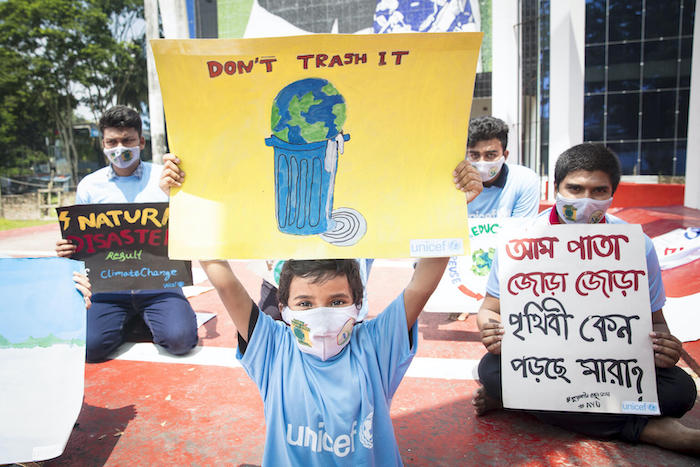 A young boy from the Global Climate Strike in Barishal joins other climate activists for a climate strike event in Barishal, Bangladesh held in September with support from UNICEF.