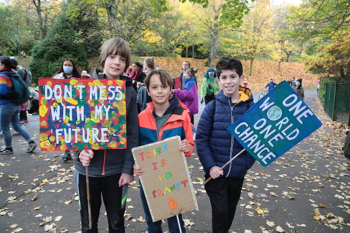 Kids join protests in Glasgow Scotland during COP26 climate summit, demanding climate action.