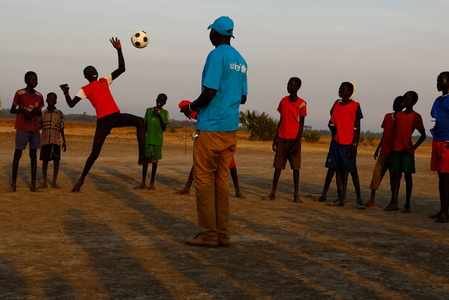 Children play soccer during a UNICEF-organized educational activity during a rapid response mission in Thonyor, Leer county, South Sudan
