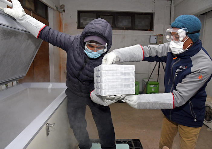  On December 24, 2021, at Central Vaccine Store at the Government of Nepal's Department of Health Services in Kathmandu, health officials and UNICEF personnel work to store 664,560 Pfizer COVID-19 vaccines donated by the U.S. Government through COVAX. 