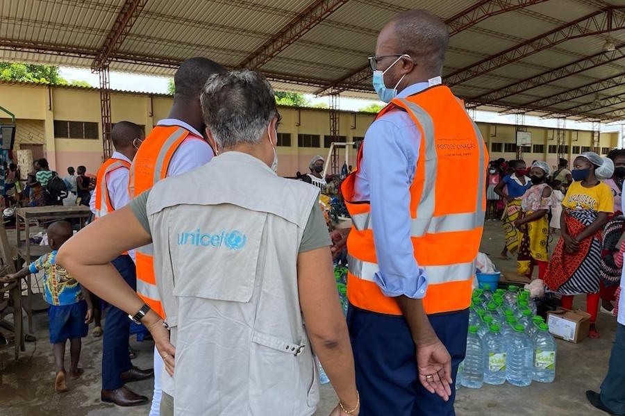 UNICEF emergency staff stand in an emergency shelter filled with people displaced by Tropical Storm Ana in Mozambique.