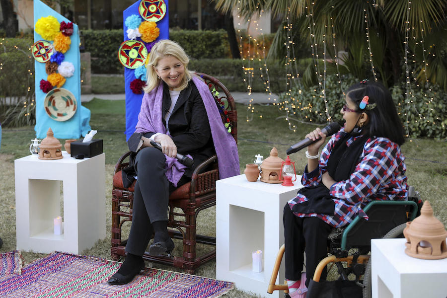 In Islamabad on Feb. 20, 2022, UNICEF Executive Director Catherine Russell speaks with 14-year-old Taqwa Ahmad, a motivational speaker and advocate for children and adolescents with disabilities.