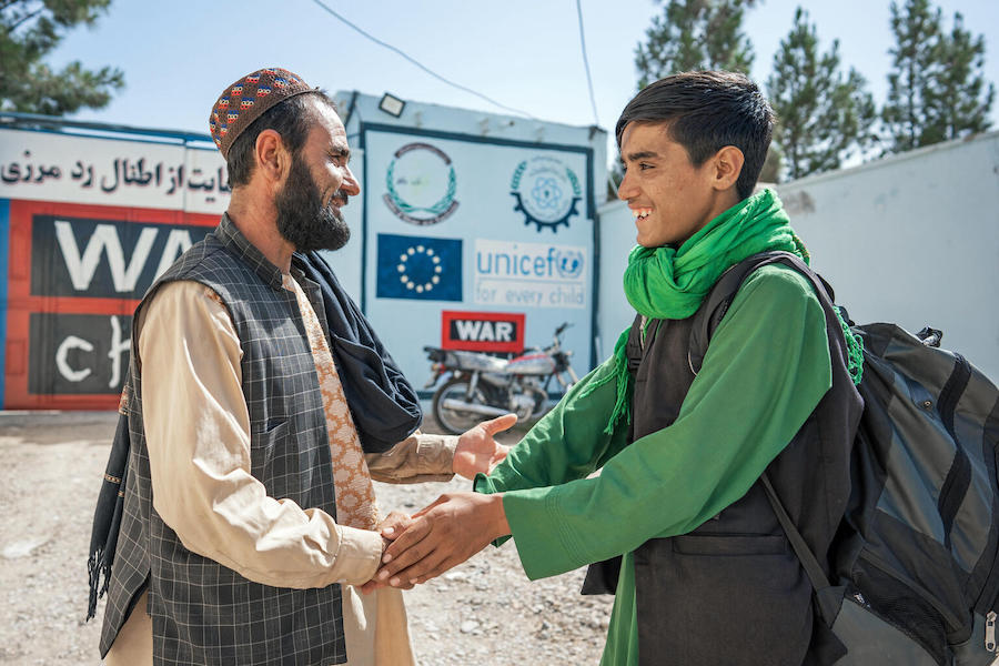 A father is reunited with 14-year-old son at the UNICEF-supported Gazargah Transit Center for returning migrant children in Herat, Afghanistan.