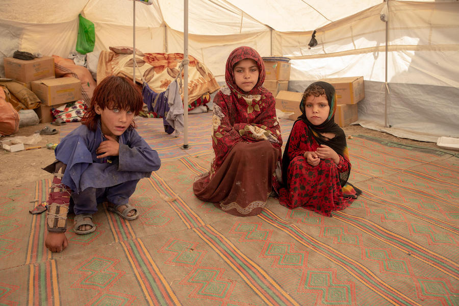Siblings Zaid Allah, 6, Mahbubeh, 9, and Nazi, 4, are living in a UNICEF tent after the June 22, 2022 earthquake destroyed their home in Barmal District, Paktika Province, Afghanistan.