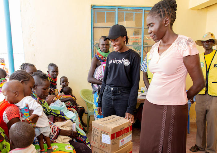 UNICEF Goodwill Ambassador Vanessa Nakate, center. meets mothers whose children are being treated for severe acute malnutrition at the Kobuin Health Center in Turkana County, Kenya. 