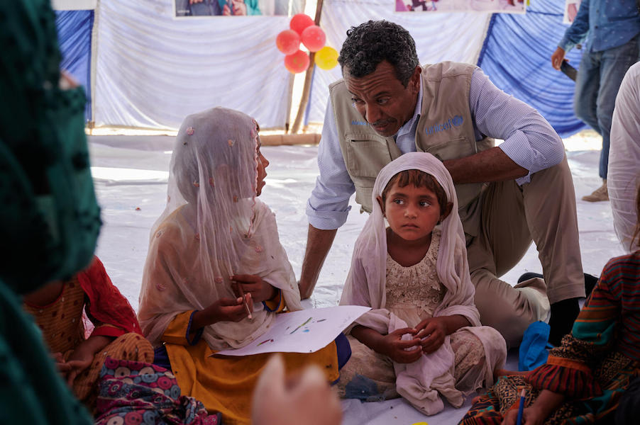 UNICEF Representative in Pakistan Abdullah Fadil visits a village devastated by flooding in Rajanpur district, Punjab Province, Pakistan, on Sept. 17, 2022, 