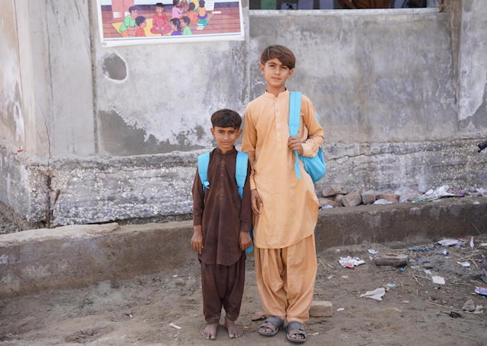 Brothers outside a Temporary Learning Center set up by UNICEF after floods in Sindh Province, Pakistan.