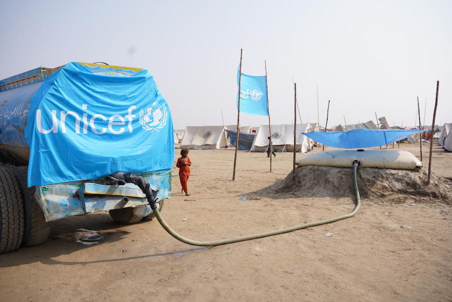 On Sept. 13, 2022, a water tanker delivers safe drinking water at a camp for flood-affected people in Khairpur district, Sindh Province, Pakistan.