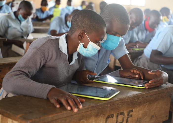 Students in Mombasa City, Kenya, work together at a school connected to the internet through the Giga initiative.