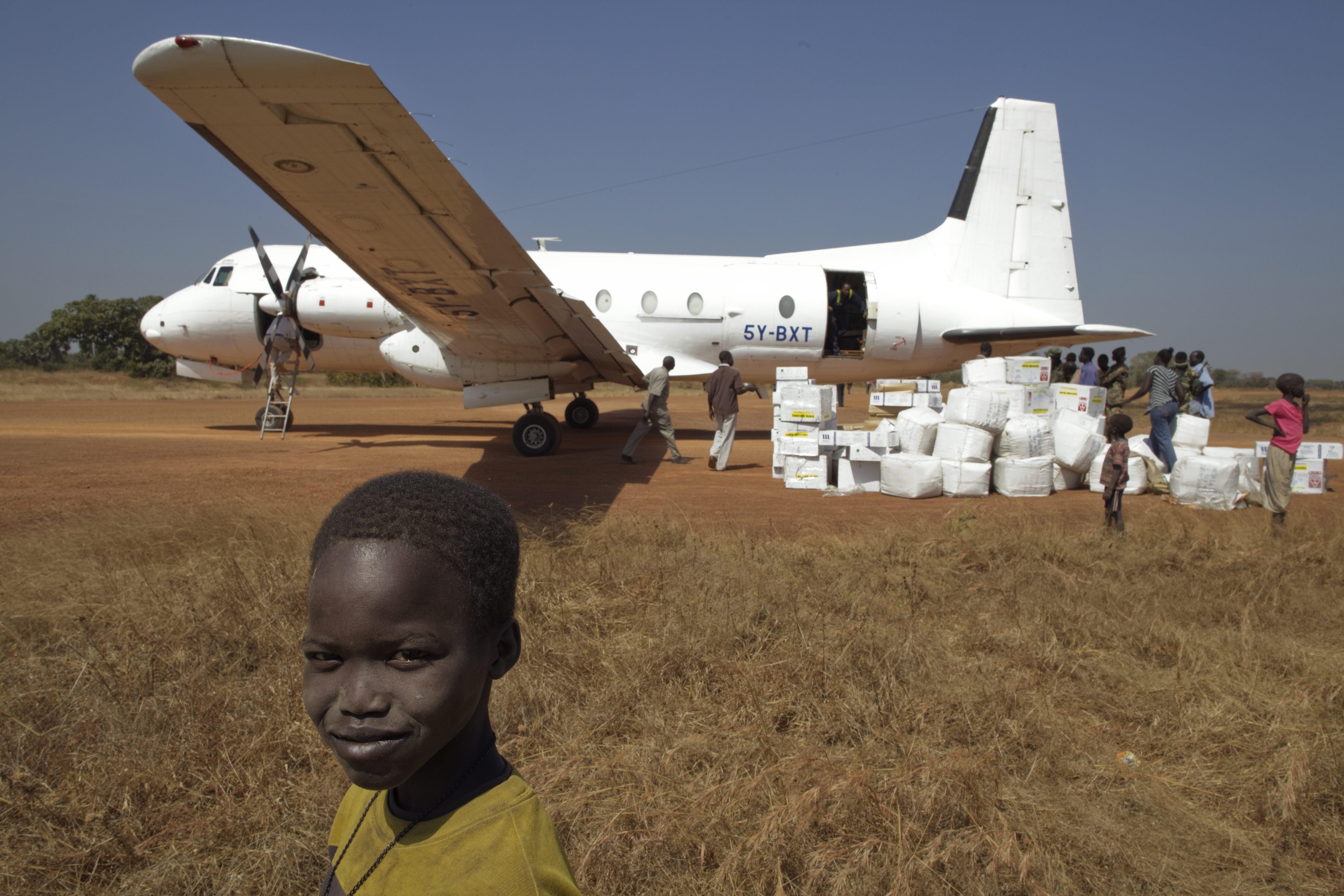 Polio vaccines from a storage facility in Juba, South Sudan, arrive at Aweil Airport. The vaccines travel in insulated shipping containers that keep them at or close to freezing to preserve their potency.  UNI122541 Credit: © UNICEF/NYHQ2011-2453/Sokol