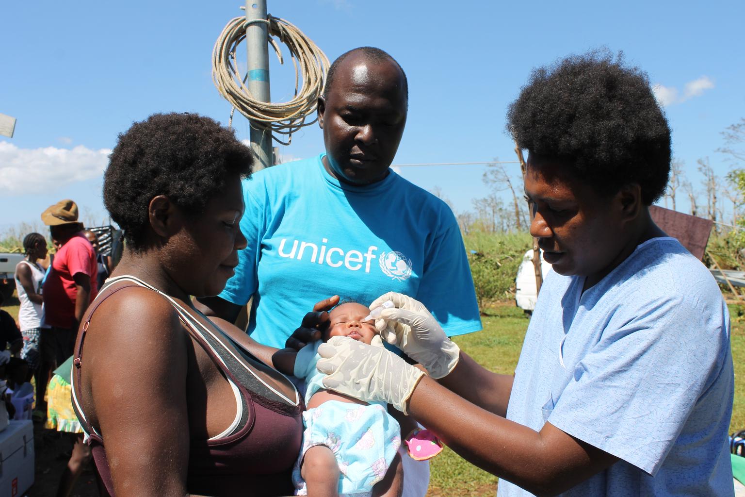 Born just a week before Cyclone Pam hit Vanuatu, on March 13, this little girl got her first polio vaccination by a UNICEF team in Etas, while her family struggled to recover from the loss of their home and village.  Image: UNI181195 © UNICEF/UNI181195/Se
