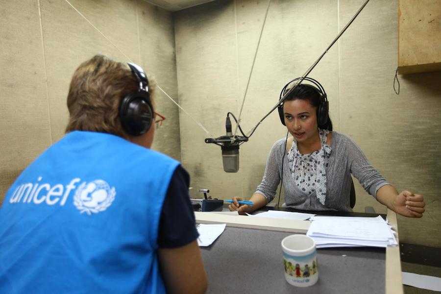 Nepal Earthquakes 2015: Anchor Archana Gurung, speaks with UNICEF staff member Natalie Fol during a segment of the new UNICEF-supported ‘Bhandai-Sundai’ (Listening-Talking) radio programme, which is being broadcast from national radio station Radio Nepal