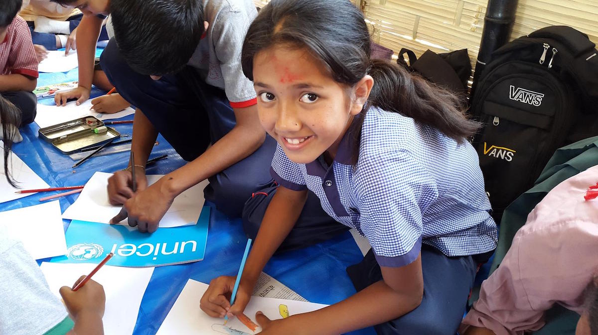 Like all of her classmates, this girl is happy to finally be back in school and drawing at the Kuleshwor School in Kathmandu, Nepal for the first time since the first of two recent Nepal earthquakes, which occurred on 25 April 2015. 