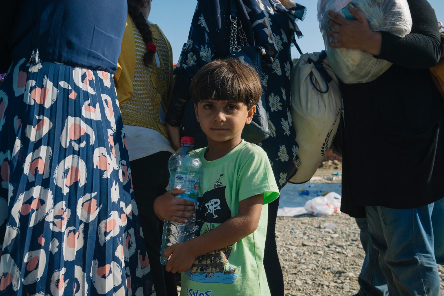 A child from Syria waits for a temporary transit visa in Gevgelija, Macedonia, after crossing the border from Greece. UNICEF is providing migrants like him with clean water
