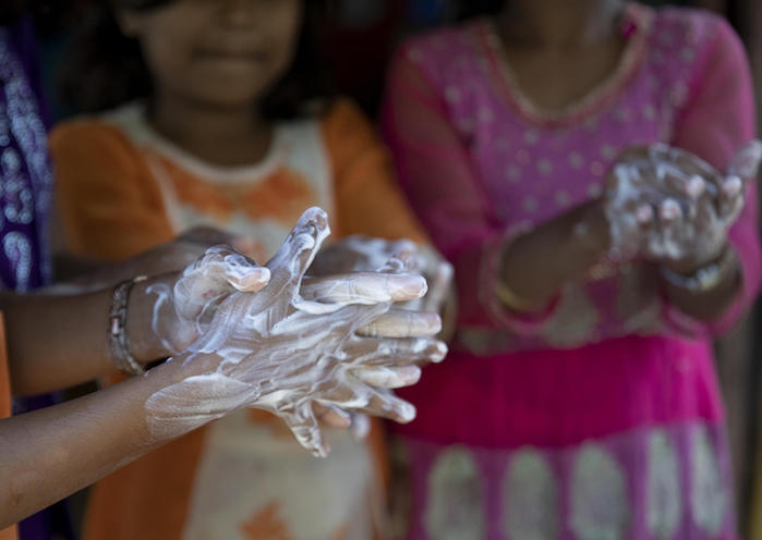 On 9 March 2020, children wash their hands with soap at a UNICEF-supported learning center in the Kutupalong camp, a Rohingya refugee camp, in Cox’s Bazar, Bangladesh.