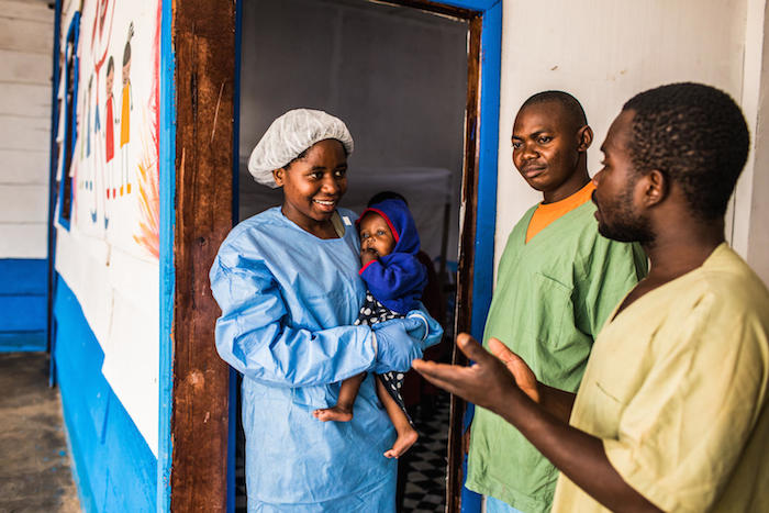 Ruth, an Ebola survivor, takes care of young children while their mothers recover from the virus with support from UNICEF.