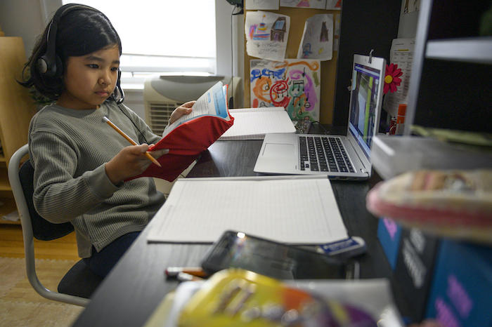 Yolanda, 9, participates in a virtual class from her home in New York City. 