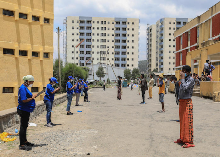 On 10 April 2020, staff with the International Organization for Migration (IOM) register returnees to Ethiopia who are undergoing a 14-day quarantine at the Civil Service University in Addis Ababa, Ethiopia.