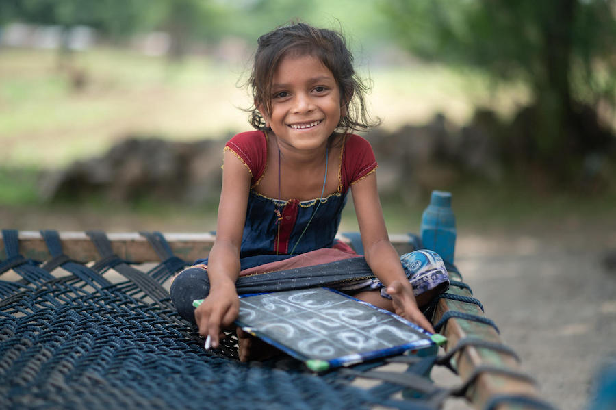 A young girl studies at home with UNICEF's support during pandemic lockdown in Dudhiya Dhara, Limkhdea, Gujarat, India.