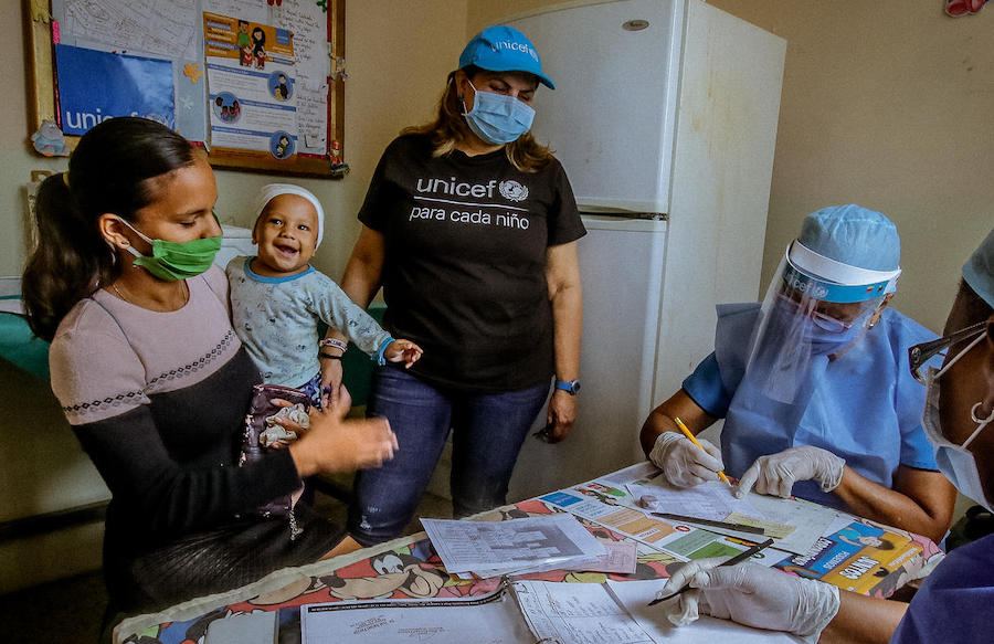 A mother and her baby receive services at a UNICEF-supported health facility in Bolivar state, Venezuela.