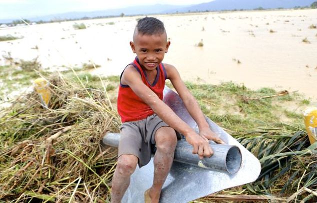 Daniel Upandez, 8, in the typhoon hit city of Palayan, Nueva Ecija Province. In any event of disasters, children are among the most vulnerable.