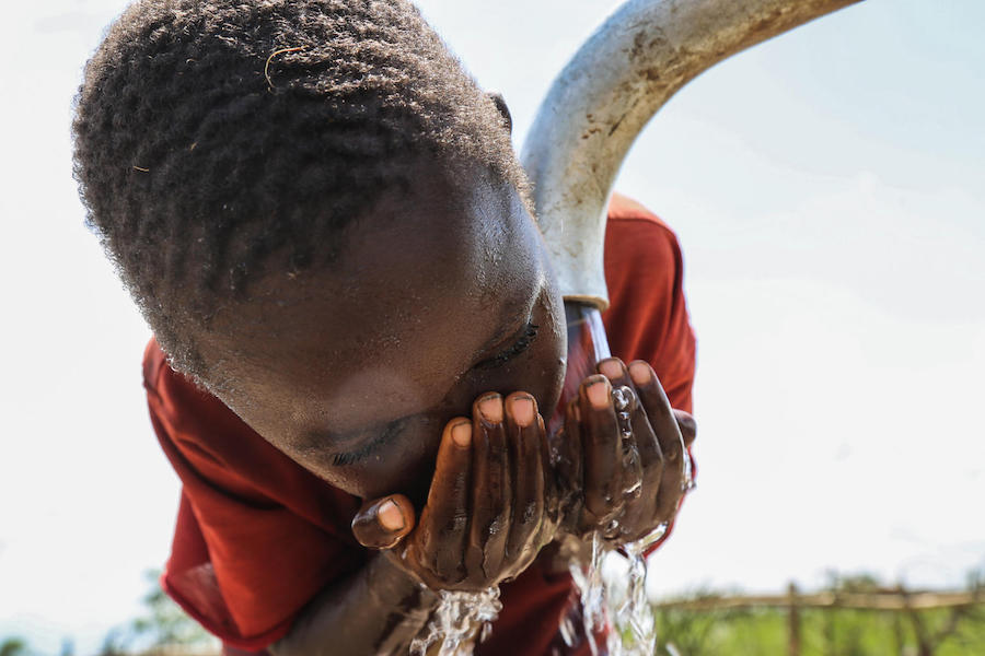 A child drinks water from a tap in Kinyinya hill, Kiyinya Commune, Ruyigi Province, Burundi, Thursday 25 January 2018. 