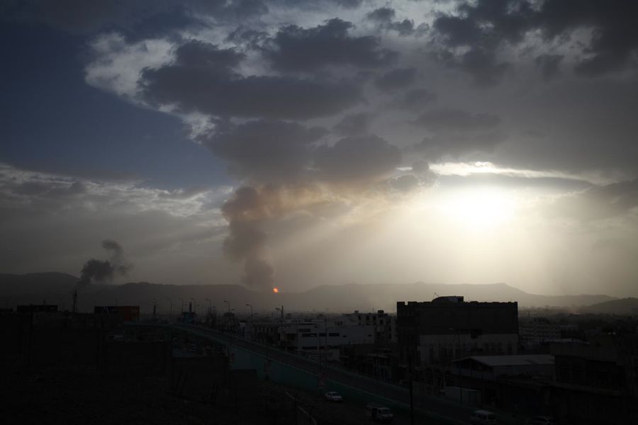 Children in conflict in Yemen, 2015: after an airstrike hit Faj Attan Mountain, above Sana’a, smoke blankets the city.