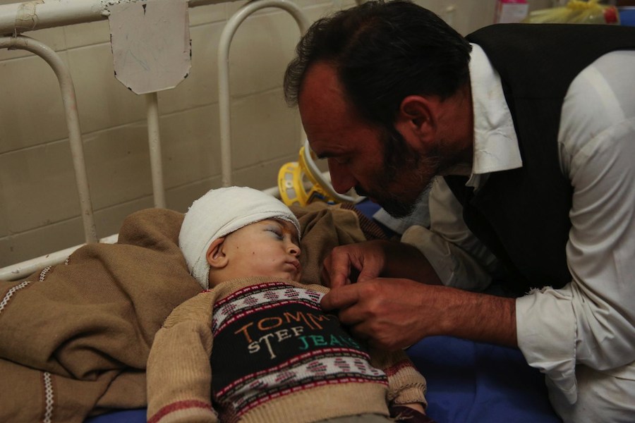 Affan , 20 month old (with his father Ramzan) is recovering from a head surgery at the Lady Reading hospital in Peshawar. He was injured during the 7.5 magnitude earthquake struck Afghanistan and Pakistan, October 26, 2015.